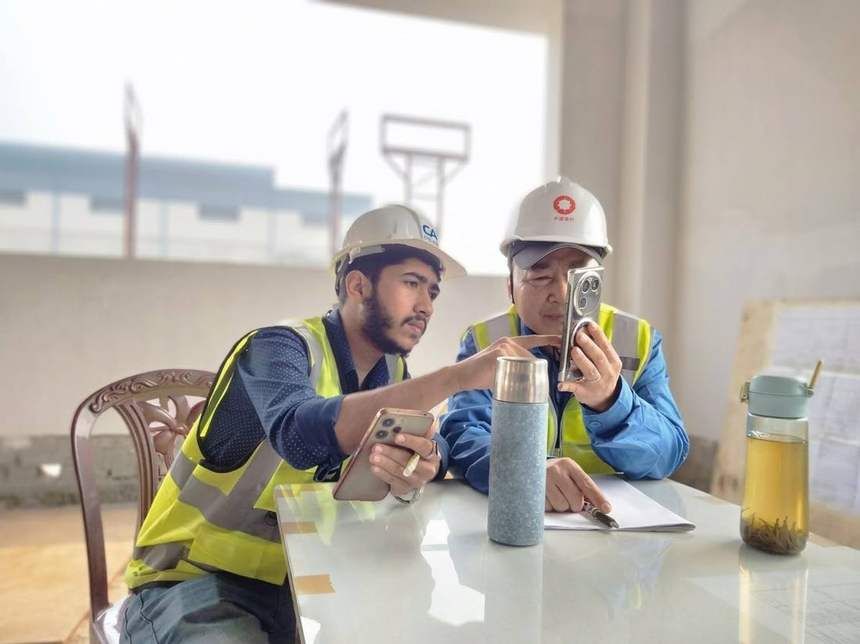 Two engineers reviewing site details